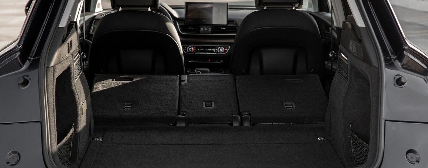 Rear cargo area in a grey 2025 Audi Q5 Sportback.
